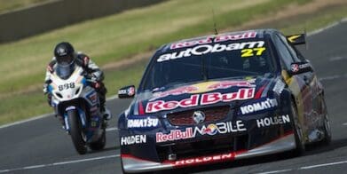 Craig Lowndes races Casey Stoner brake