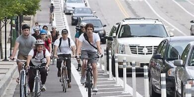 Cyclists in bike lanes ride to work day lane filtering bus lanes reward