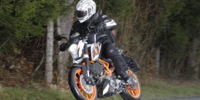 KTM 390 Duke riding in the wet rain students