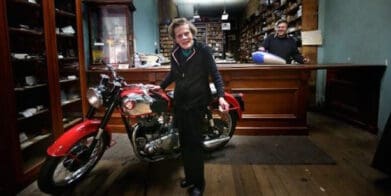 Mrs Beanham in her Modak Motorcycles shop Rally to honour motorcycle shop icon