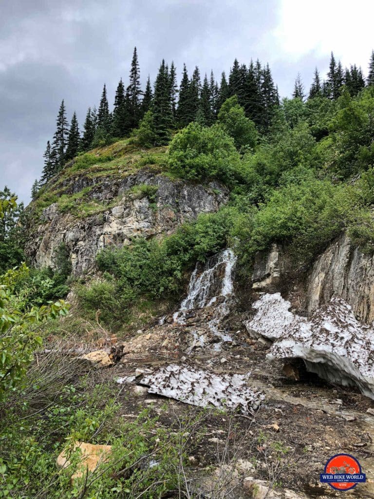 Melting snow and runoff coming down the rock wall.