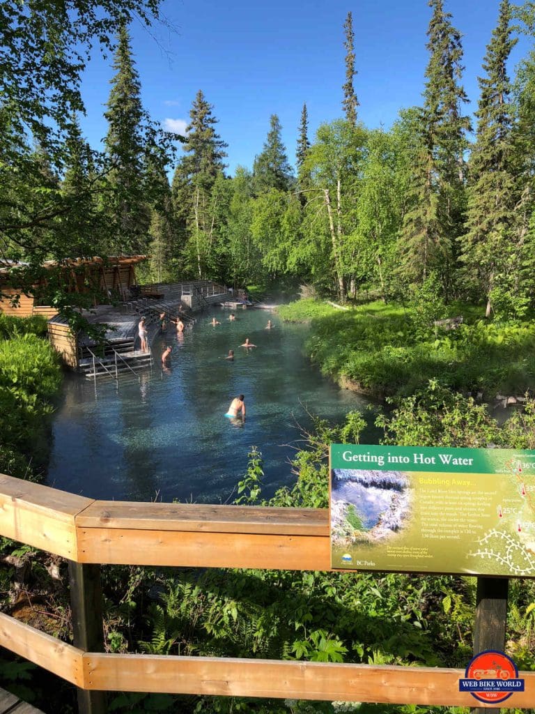 A view of people enjoying the hot water at Liard Hot Springs.