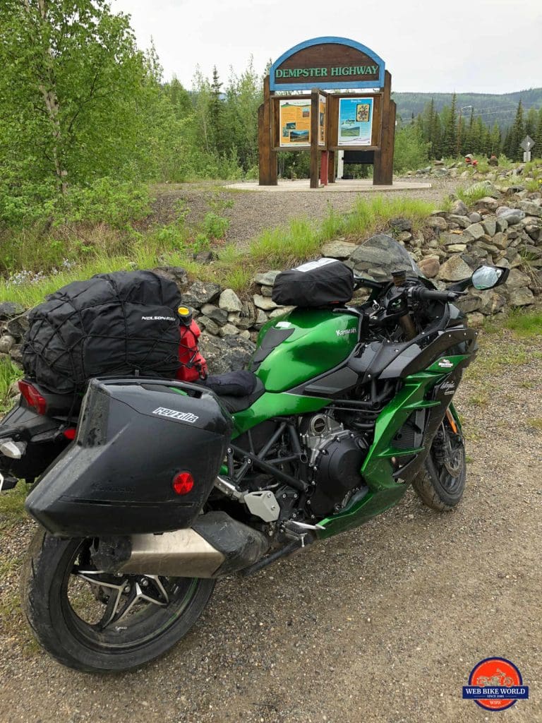 My Ninja H2SX SE at the marker sign for the Dempster highway.