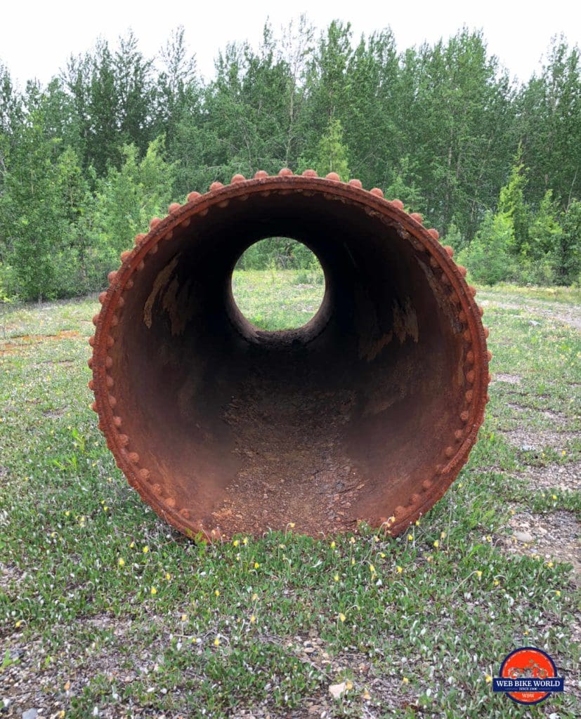 A large pipe used to move water to mining dredges near Dawson City.