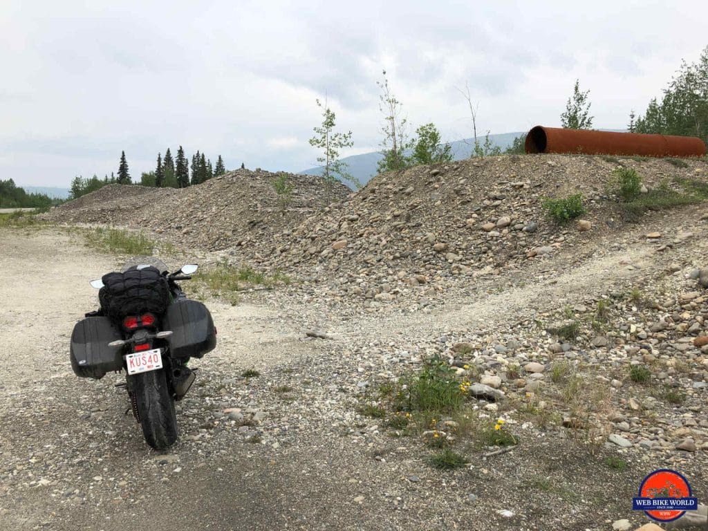 My Ninja H2SX SE parked beside the piles of tailings outside Dawson City.