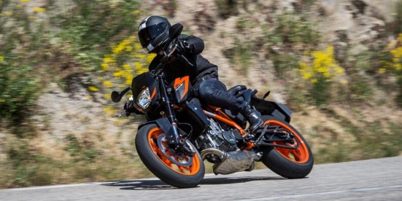 A KTM duke leans into a right turn.