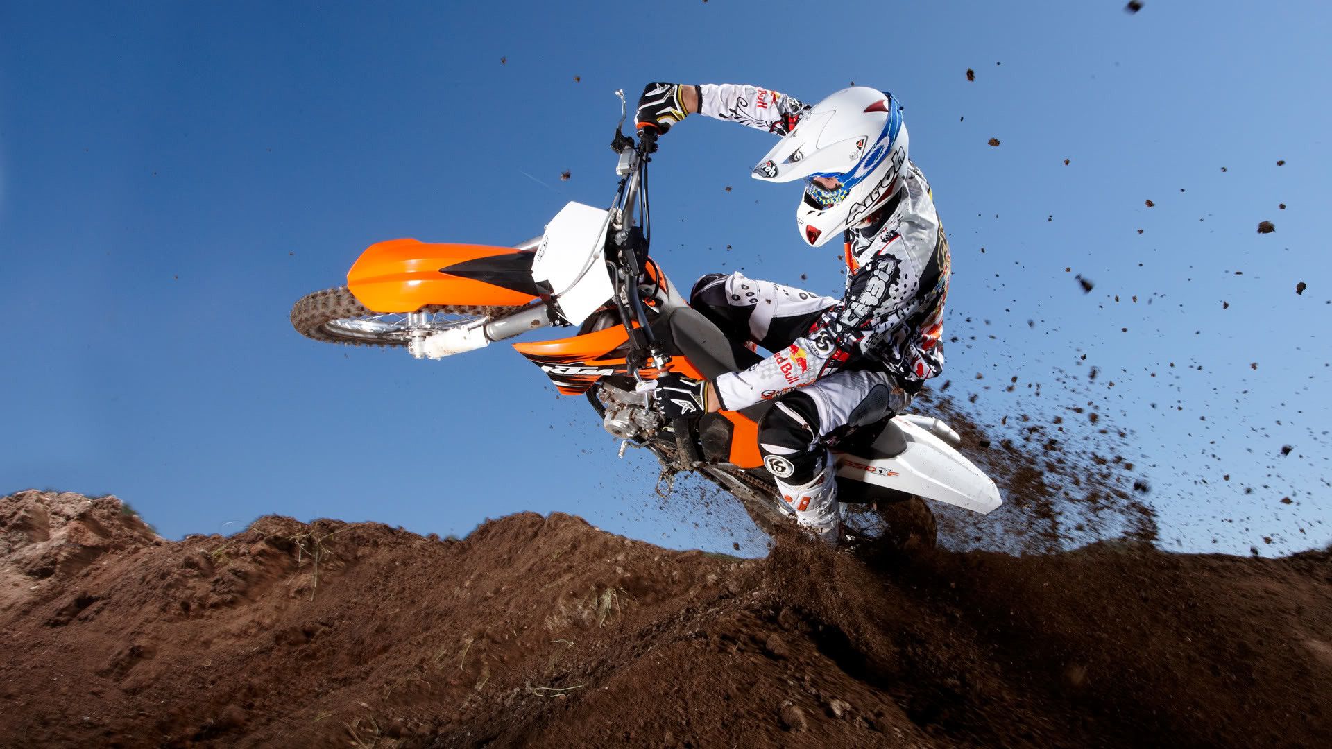 Wallpaper Man Riding Motocross Dirt Bike on Brown Sand During Daytime  Background  Download Free Image