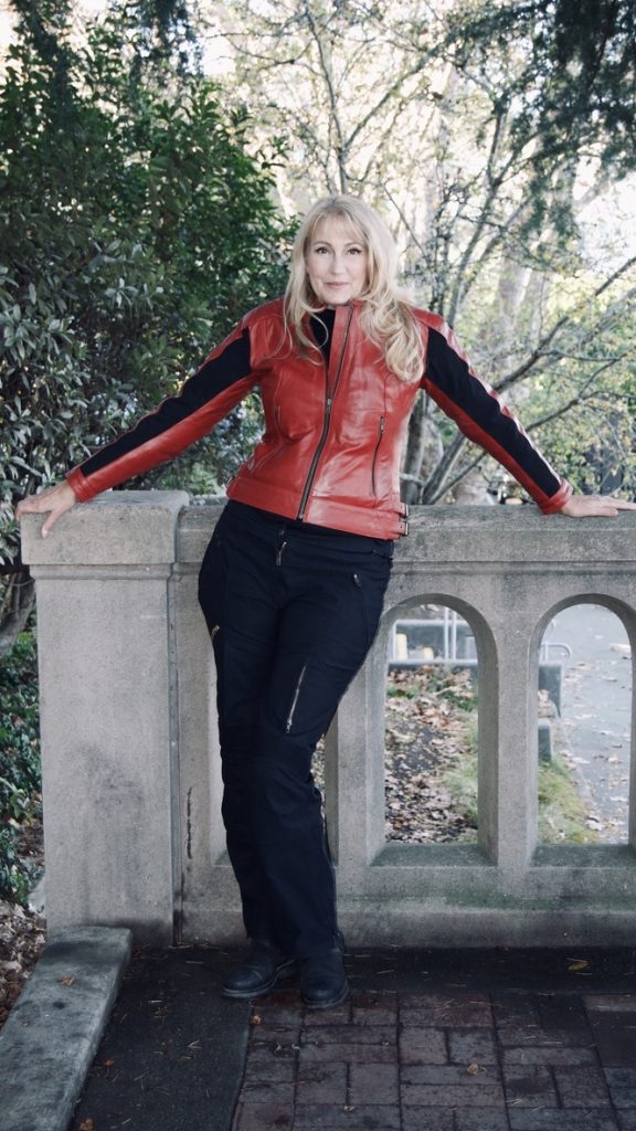 A model featuring the Raven Rova Phoenix Ruby Red Leather Jacket