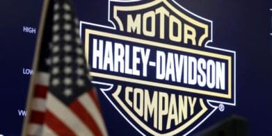 A view of the Harley-davidson logo with an American flag in front of it