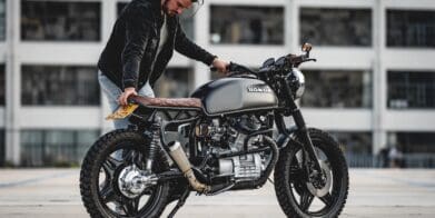 A view of a man working on a motorcycle build