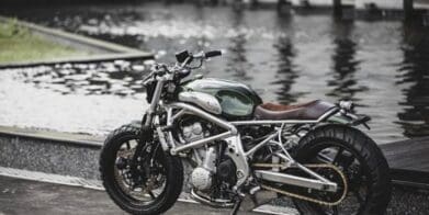 A 2006 Kawasaki ER-6F that's been tricked out with a retro, cafe racer flair