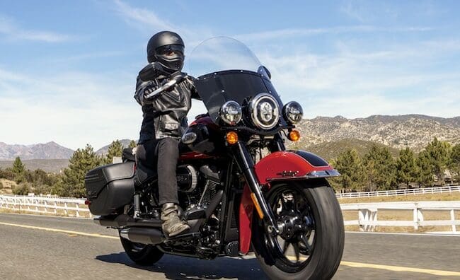 A view of a harley bike with rider enjoying the rugged topography