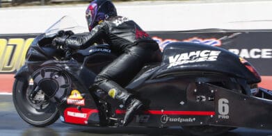 A view of a NHRA PSM drag Bike on the strip