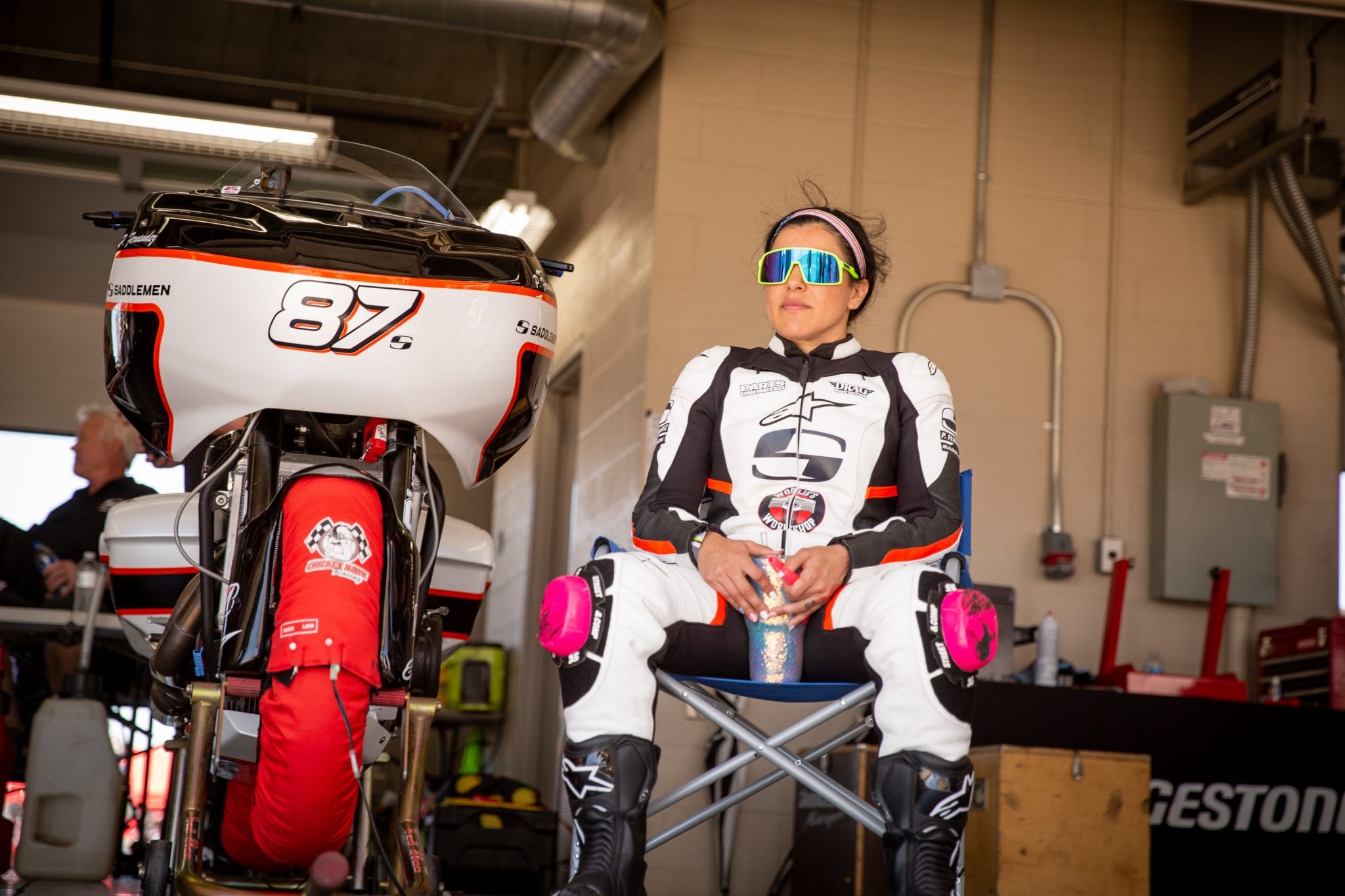Patricia Fernandez next to her racing bagger