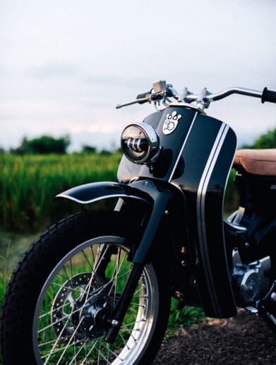 A view of the Honda Cub custom built by Deus Ex Machina Custom Bike Shop