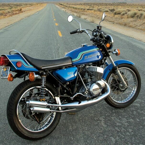 A 1972 kawasaki H2 MkIV motorcycle on a desert road at sunset in America