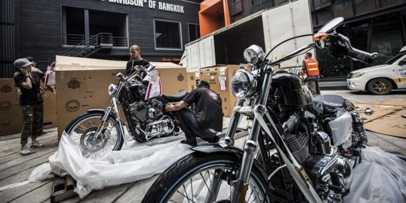 Harley-Davison employees working at a dealership. Media sourced from Hot Cars.