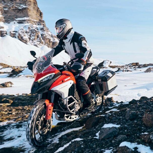 A rider trying out the AGV Tourmodular Helmet. Media sourced from Ultimate Motorcycling.