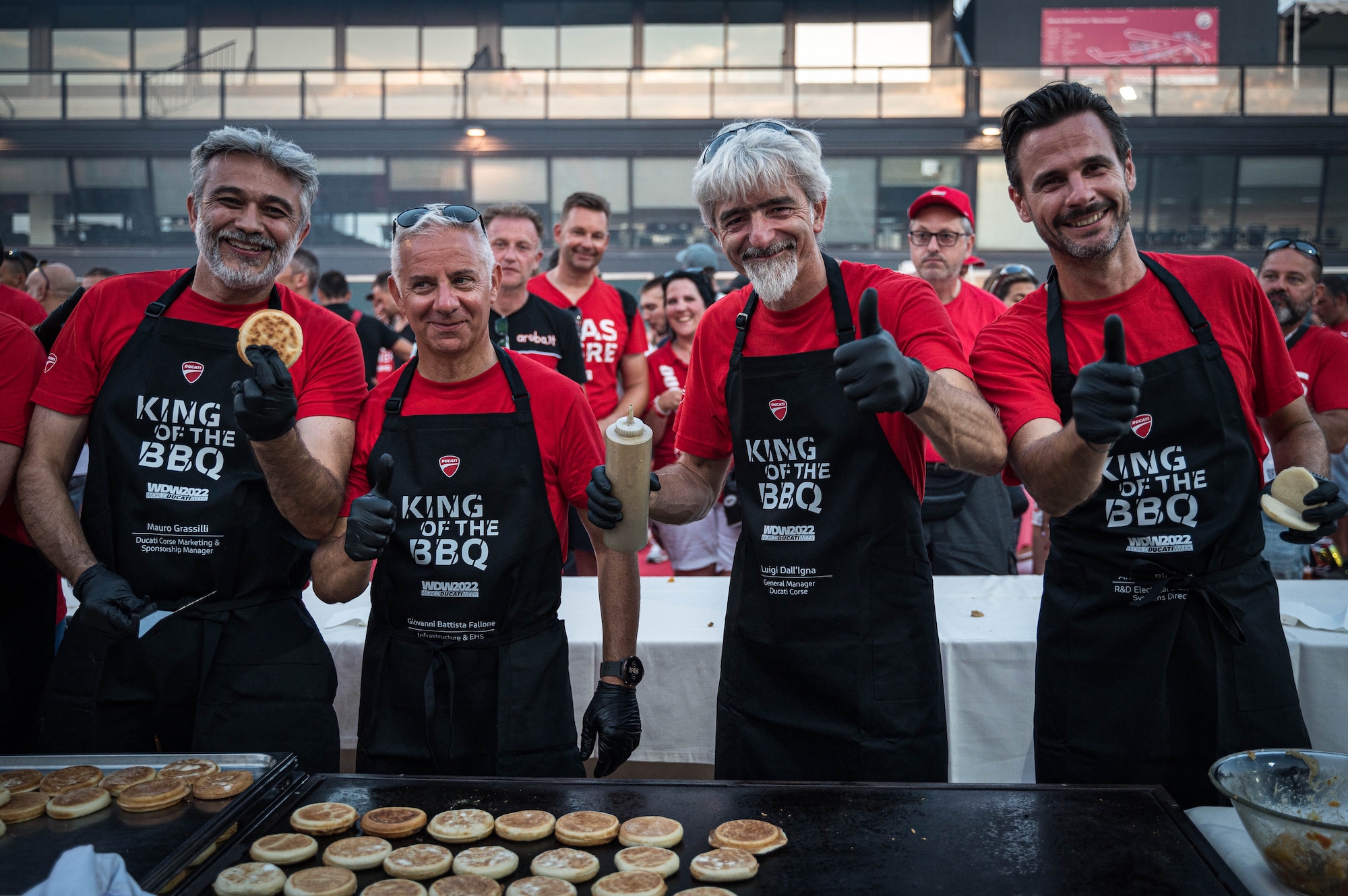 Members of Ducati keeping the barbecue lit and feeding the masses present at 2022's iteration of the World Ducati Week.
