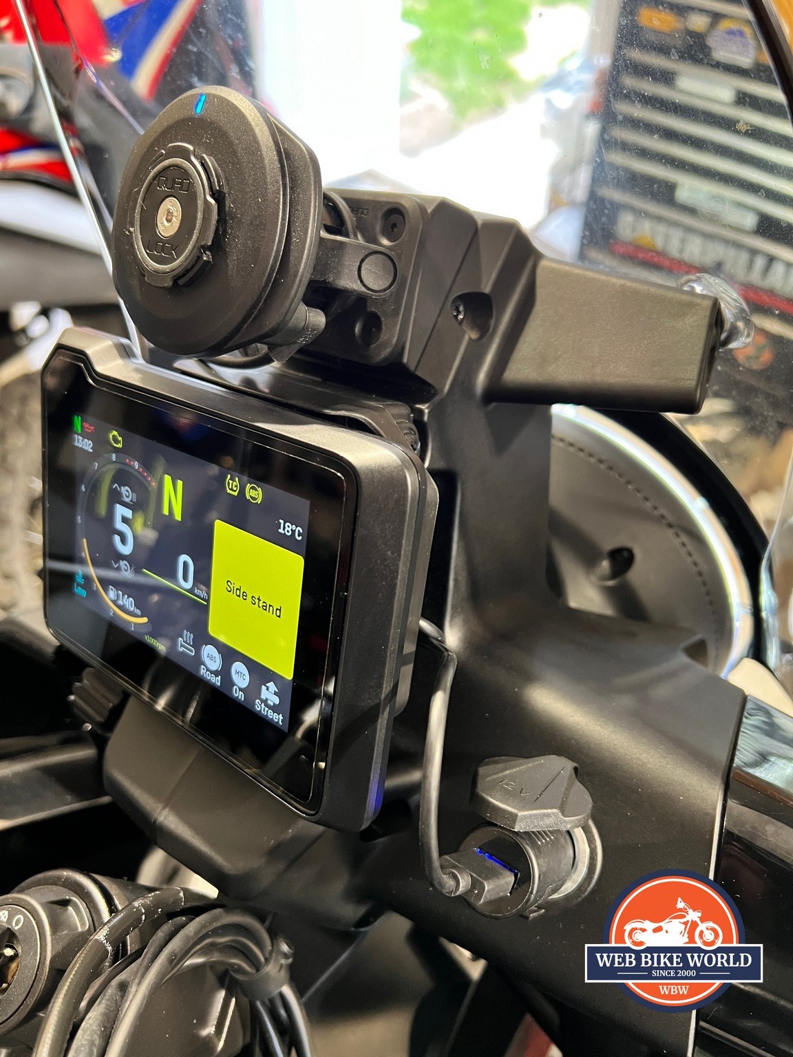 Quadlock Waterproof 12V to USB Smart Adaptor install on a Triumph Street  Triple RS Motorcycle 