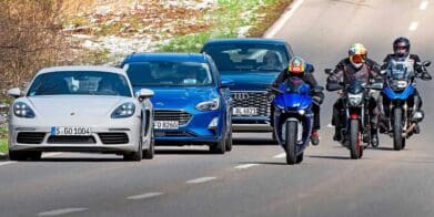 A view of cars driving next to motorcycles. Media courtesy of RideApart.