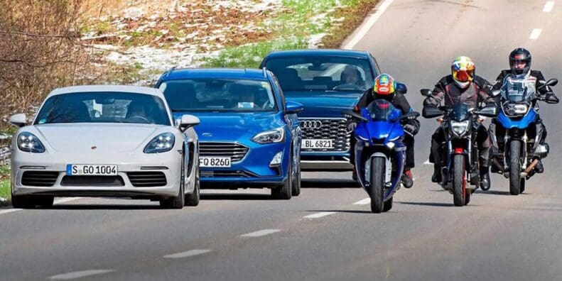 A view of cars driving next to motorcycles. Media courtesy of RideApart.