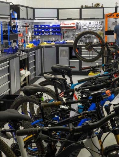 Technicians in workshop service multiple electric bike models