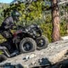 Rider on a 2023 Kawasaki Brute Force 300 climbing up a rockface.