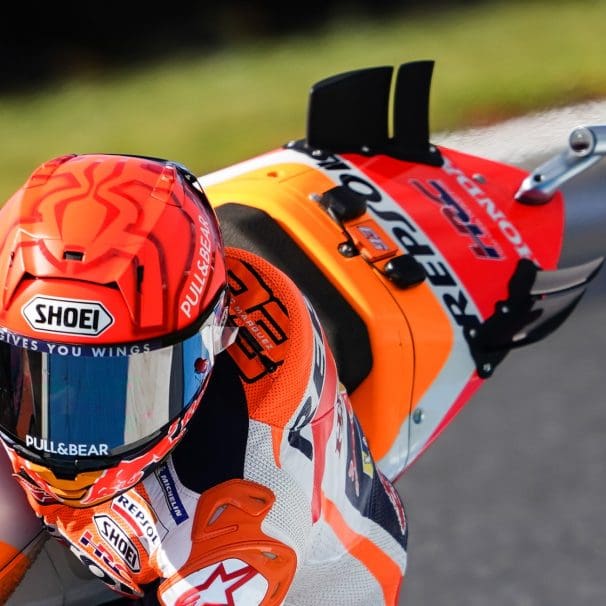 A view of racers on the MotoGP grid, doing what they do best. Media sourced from The-Race.