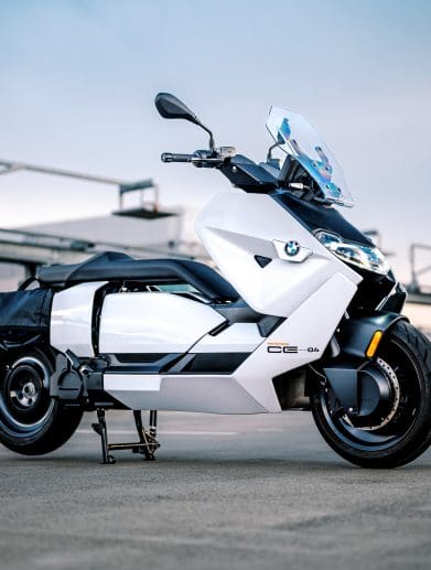 BMW's CE-04 electric scooter on a carpark rooftop at sunset