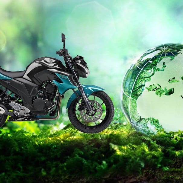 A view of Yamaha's 2019 FZ25 next to a globe representing sustainability. Media sourced from TWI Global and Yamaha Motorcycles.