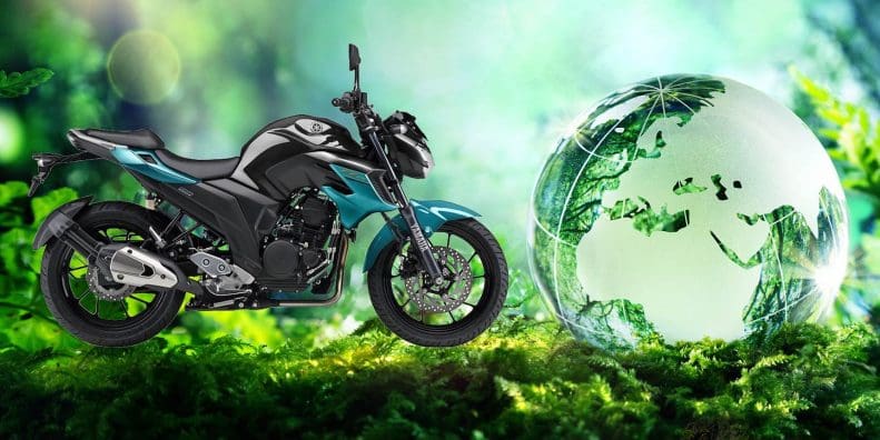 A view of Yamaha's 2019 FZ25 next to a globe representing sustainability. Media sourced from TWI Global and Yamaha Motorcycles.