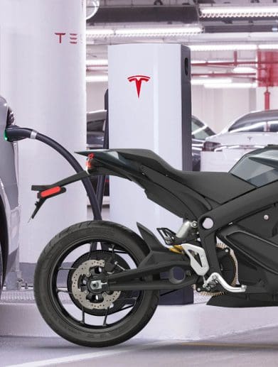 A Zero motorcycle next to a Tesla Supercharger station. Media sourced from Zero Motorcycles and Teslarati.