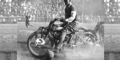 A motorcyclist playing ball.