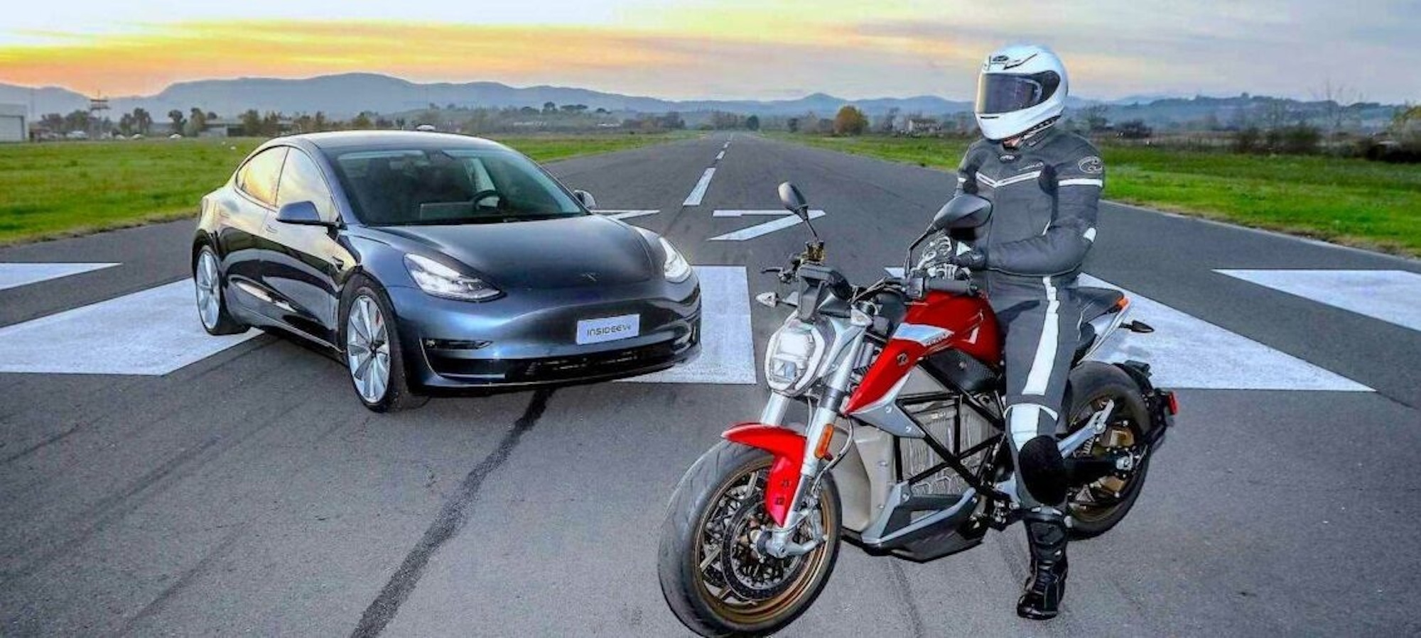 A picture of a Tesla car next to a motorcycle. Media provided by FEMA.