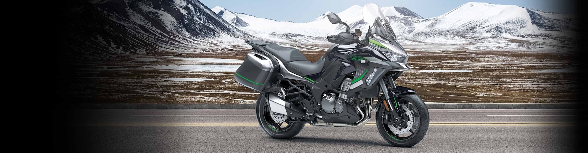 A sive view of Kawaasaki's Versys 1000 in front of mountains.