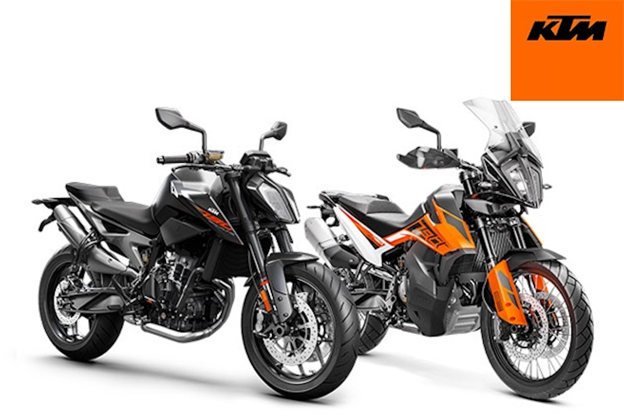 Two KTM motorcycles against a white background.