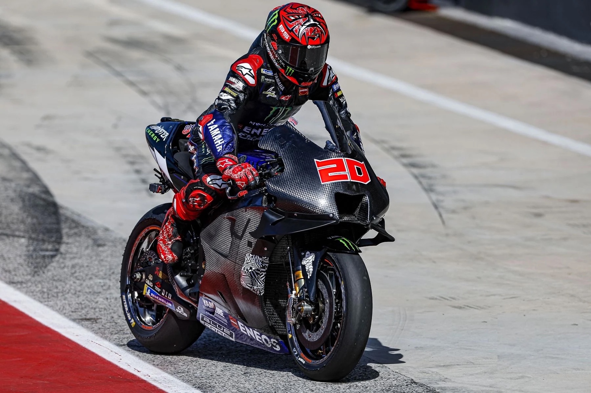 A view of a racer on a Yamaha race bike.